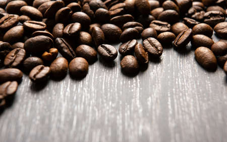coffee beans on a wooden backgroundの写真素材