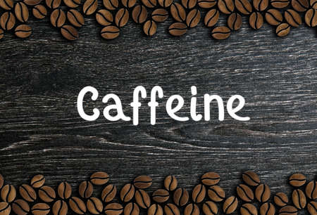 coffee beans with inscription caffeine on a wooden background illustrationの写真素材