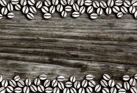 raw coffee beans in a row on a wooden background illustrationの写真素材