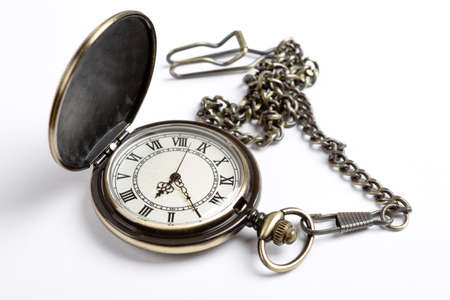 pocket watch on a white table closeup conceptの写真素材