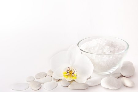 White balm salt, orchid and stones on white backgroundの写真素材