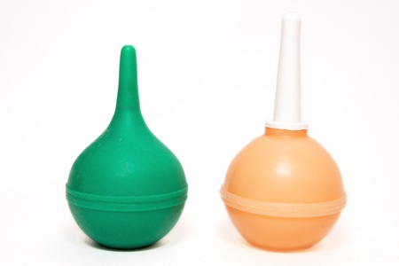 Two medical rubber enemas isolated on a white backgroundの写真素材