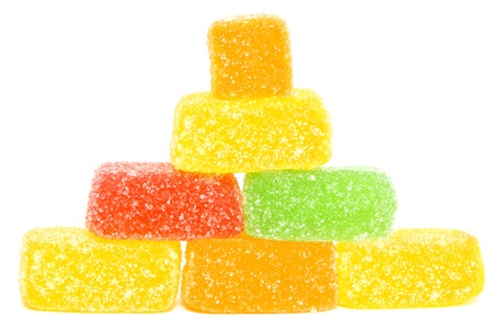 Pyramide made by jelly candies isolated on a white background.の写真素材