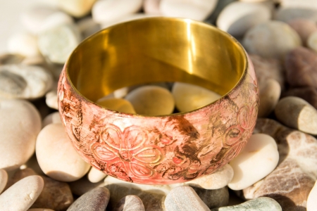  Bracelet from India on sea peblrs close up.の写真素材