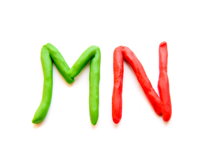 plasticine letters MN isolated on white backgroundの写真素材