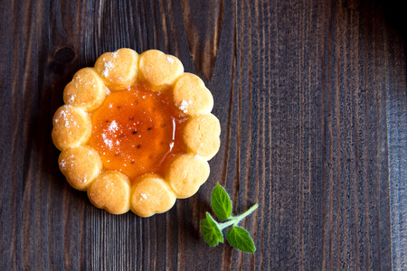 Fresh cookies with fruit jelly over rustic wooden background close upの写真素材