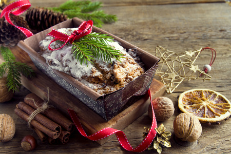 Traditional fruitcake for Christmas with decoration and ornaments - homemade Christmas pasrtyの写真素材
