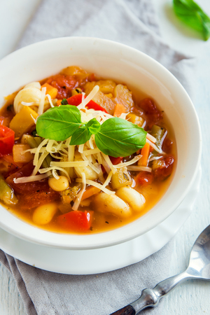 Homemade Italian Minestrone Soup with Cheese and Basil - healthy homemade hot vegetarian diet vegan meal food soupの写真素材
