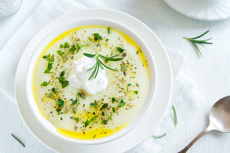 Homemade cauliflower and potato soup with cream cheese, rosemary, herbs and spices  - fresh organic vegetable vegetarian vegan spicy diet cream soup meal foodの写真素材