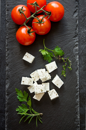 Fresh Greek Feta Cheese. Healthy ingredient for cooking salad. Goat feta cheese with herbs.の写真素材