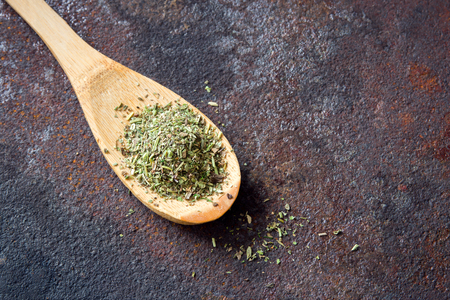 Mixed Italian Herbs Seasoning on rustic metal background, copy space. Dried Herbs Seasoning, healthy ingredient for cooking.の写真素材