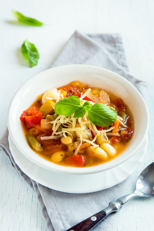 Homemade Italian Minestrone Soup with Cheese and Basil - healthy homemade hot vegetarian diet vegan meal food soupの写真素材