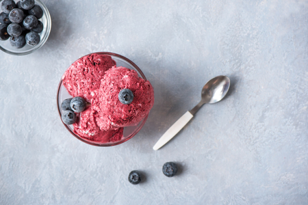 Healthy homemade raw vegan banana and berry ice cream (icecream, nicecream) topped with organic blueberries and mint - healthy vegetarian diet vegan raw fruit organic delicious dessert, dairy free, gluten freeの写真素材