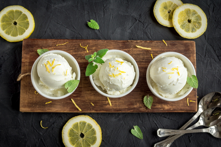 Lemon Ice Cream in bowl. Homemade citrus lemon ice cream (gelato) with mint close up.の写真素材