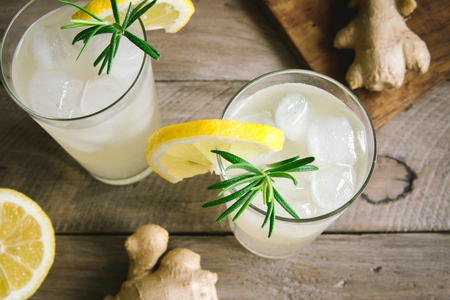 Ginger Ale or Kombucha in Glasses - Homemade lemon and ginger organic probiotic drink, copy space.