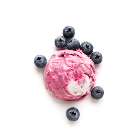 Blueberry Ice Cream isolated on white background, top view, copy space. Scoop of pink berry blueberry icecream with fresh blueberries.の写真素材
