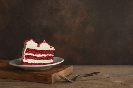 Red Velvet Cake. Piece of Red Velvet Cake on wooden table, copy space.の写真素材