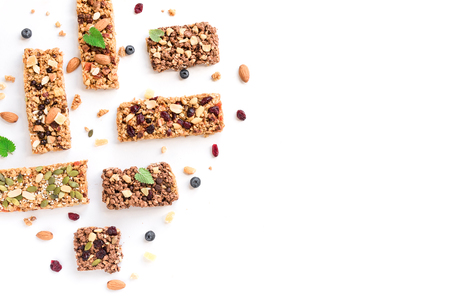 Granola bars assortment isolated on white background, copy space. Homemade healthy snack - granola superfood bars.の写真素材