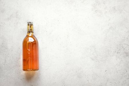 Kombucha or cider fermented drink in bottle on white background, copy space. Heathy probiotic drink - kombucha.の写真素材