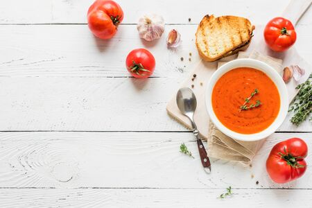 Tomato Soup with grilled cheese sandwich, top view, copy space. Homemade tomato soup with thyme.の写真素材