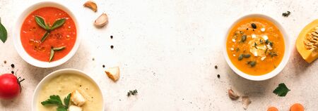 Soup Assortment. Set of various seasonal vegetable soups and organic ingredients, banner, copy space. Homemade colorful vegan vegetarian soups.の写真素材