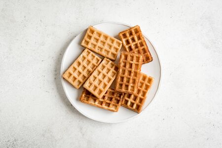 Savory egg and cheese waffles (chaffles) for breakfast. Keto (ketogenic) recipe - morning protein waffles, top view, copy space.の写真素材