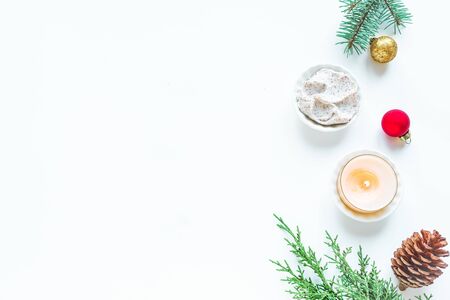 Christmas Spa Set, flat lay with ornaments, fir branches and candle on white background, copy space. Winter festive relax and spa concept.の写真素材