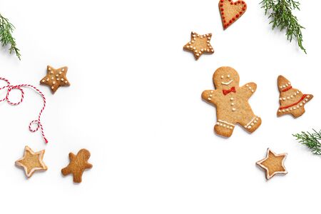Winter Christmas composition with gingerbread cookies and christmas decor, flat lay on white background, top view, copy space.の写真素材