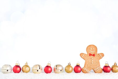 Christmas composition with Gingerbread man on white background with bokeh lights. Trendy Christmas...