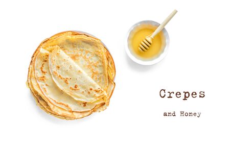 Crepes (Blini) and Honey isolated on white background, top view. Homemade thin crepes for breakfast or dessert.の写真素材