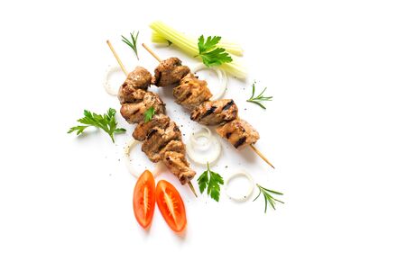 Grilled pork skewers isolated on white background, top view. Meat pork, chicken or turkey shish kebab with vegetables, herbs and spices.の写真素材