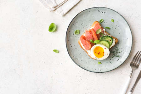 Autumn breakfast - pancakes with caramelized apples, pecan nuts and honey on wooden table, top view. Healthy seasonal vegetarian meal.の写真素材