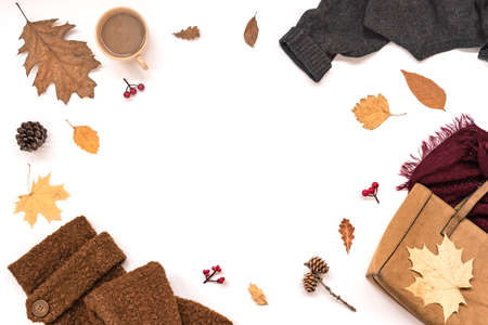 Autumn composition - suede bag, cozy clothes, autumn leaves and coffee isolated on white background,...