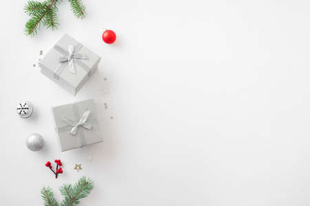 Christmas composition. Christmas decor, gift boxes, pine cones on white background. Top view, copy space.の写真素材