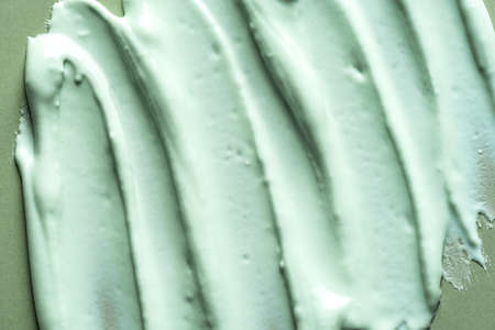 Alginate mask or green clay bentonite facial mask, body wrap texture, close up. Abstract background...