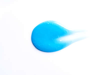 Blue shampoo or shower gel sample drop isolated on white background. Blue gel cosmetic product swatch.の写真素材