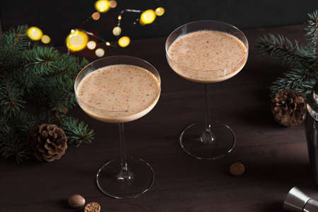 Christmas Brandy Alexander Cocktail on wooden table with Christmas decor. Festive cocktail drink.の写真素材