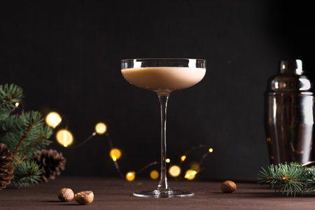 Christmas Brandy Alexander Cocktail on wooden table with Christmas decor. Festive cocktail drink.の写真素材