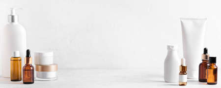 Skincare Beauty Products on white table, assortment of cosmetics bottles, healthy cosmetology, spa treatment concept, copy space.の写真素材