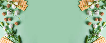 Pesah celebration concept (Jewish Passover holiday), copy space, banner. Traditional matza bread,...
