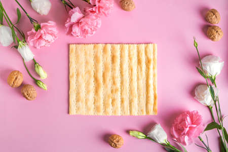 Pesah celebration concept (Jewish Passover holiday), copy space. Traditional matza bread texture,...