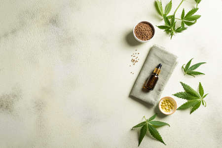 Hemp oil, leaves and seeds, cbd oil in bottle and capsules, alternative medicine and organic skin care concept. copyspace.の写真素材