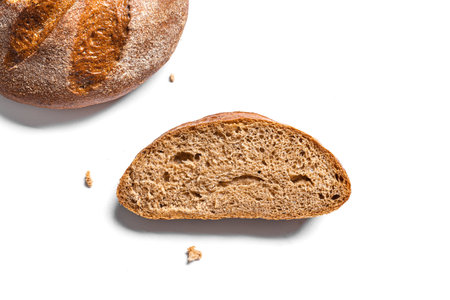 Slice of Sourdough Bread isolated on white background. Piece of yeast rye or wheat artisan bread,...