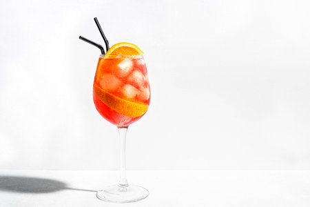 Spritz Cocktail in glass with orange slices isolated on white background, copy space. Alcohol Spritz Aperetivo.の写真素材
