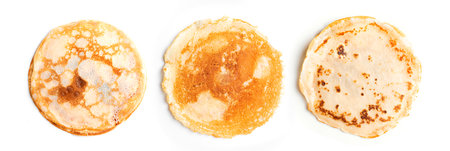 Homemade crepes pancakes isolated on white background, top view, design elements. Three crepe...