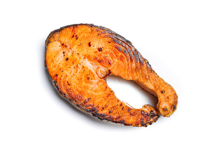 Roasted salmon fish steak isolated on white background. Healthy food, fitness menu.の写真素材