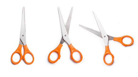 Orange multipurpose scissors set isolated on white background. Open and close scissors.の写真素材