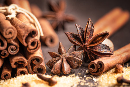 Traditional Christmas aromatic spices and brown sugar close up. Ingredients for mulled wine....