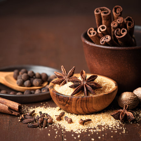 Traditional Christmas aromatic spices and brown sugar. Ingredients for mulled wine. Aesthetic...