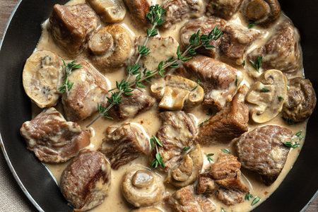 Creamy Chicken or Turkey Meat and Mushroom Stew with thyme very close up, detailed texture. Homemade comfort food, cooking meat stroganoff.の写真素材